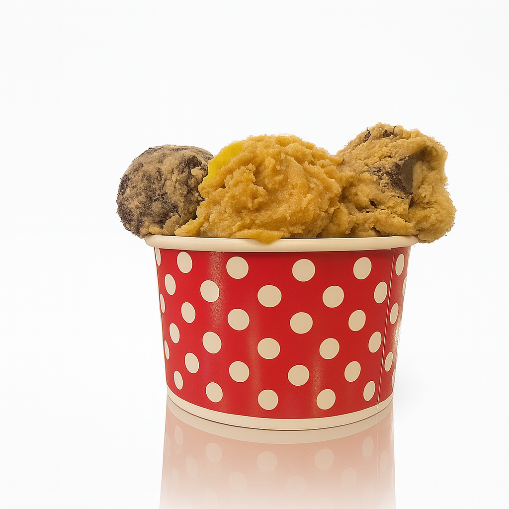 Three scoops of edible cookie dough flavors in a cup at Cookie Dough Creations