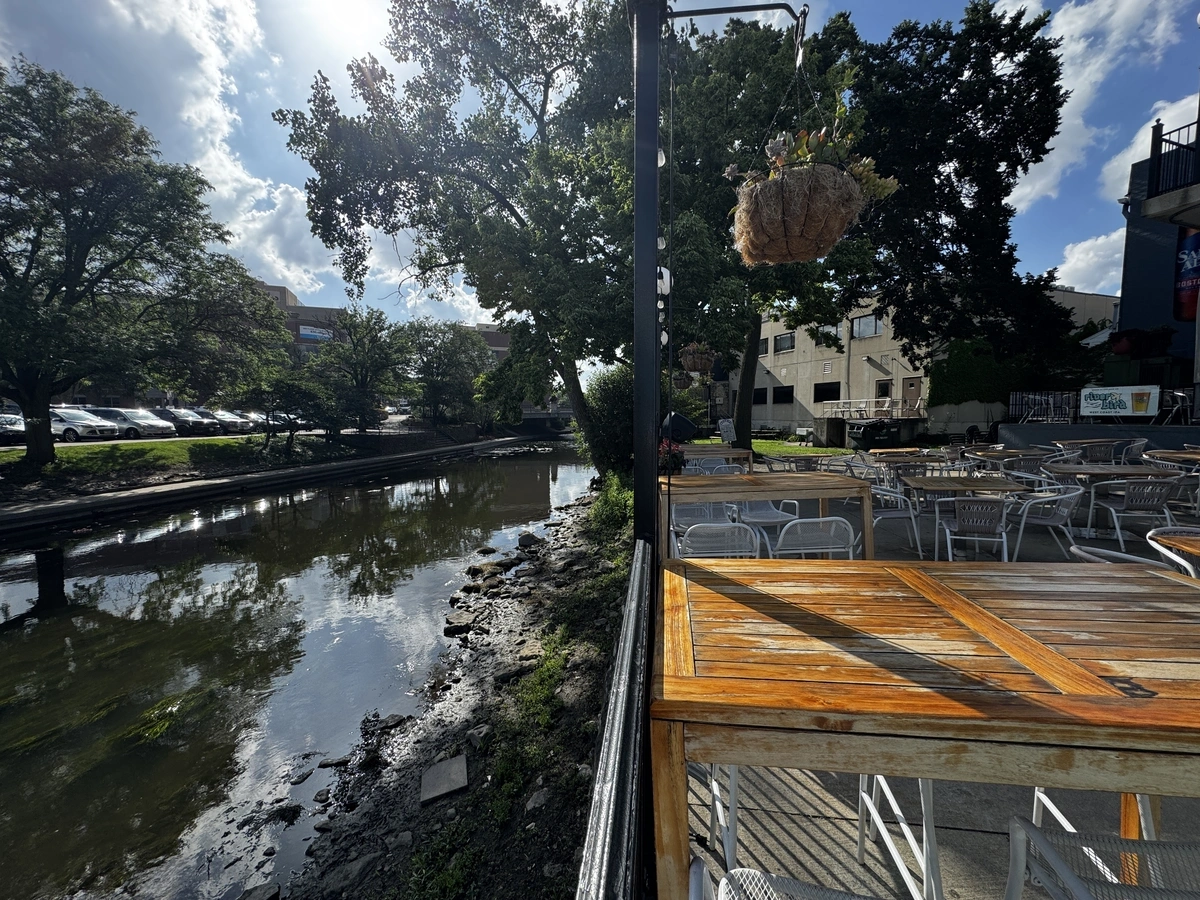 The Naperville Riverwalk seen from the shared patio near Cookie Dough Creations