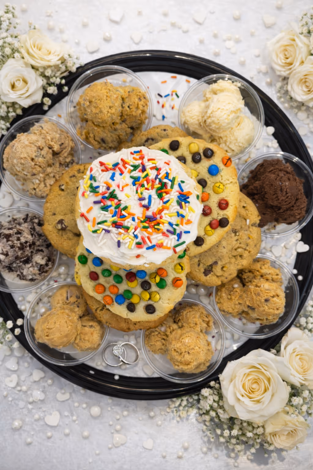 Party box with assorted oversized cookies and cookie dough cups